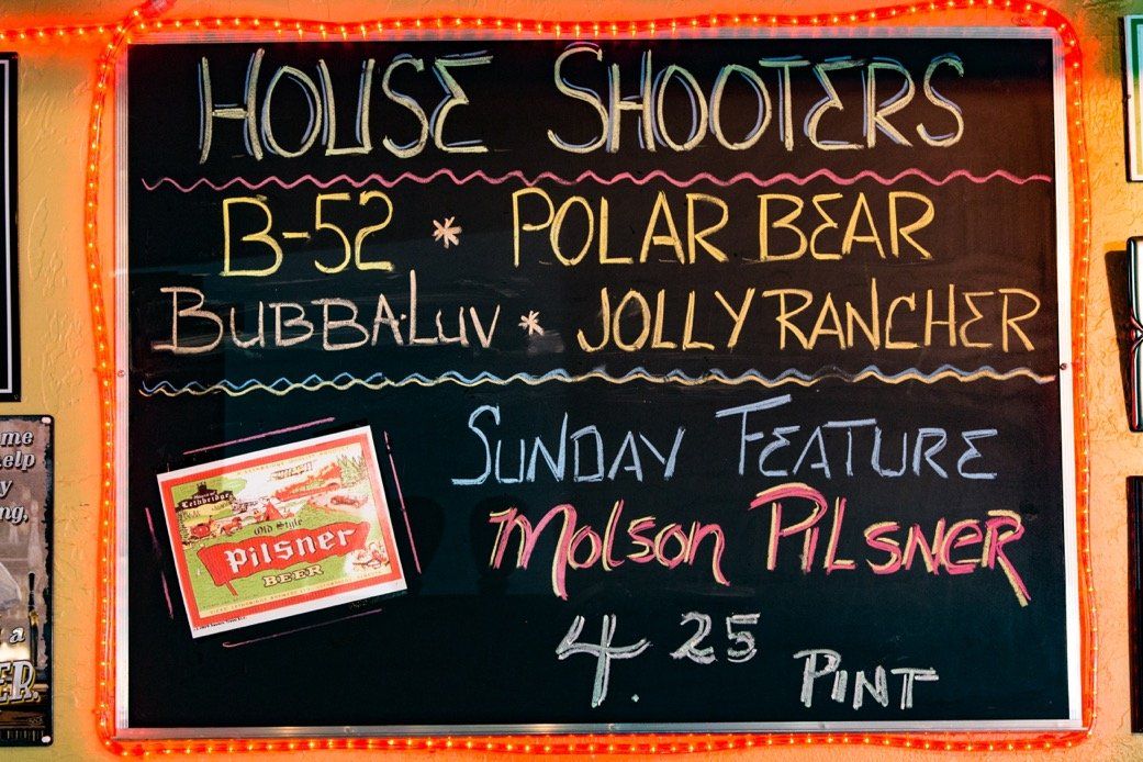 Chalkboard of house shooters and the Sunday Molson Pilsner feature