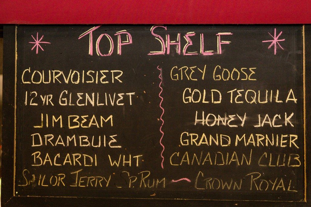 Chalkboard listing the top shelf spirits